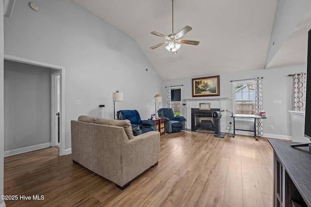 2902 Brems Battery, New Bern, NC 28562 - living room featuring high vaulted ceiling, a ceiling fan, wood finished floors, and a fireplace with raised hearth