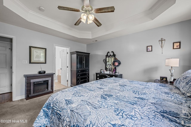 2902 Brems Battery, New Bern, NC 28562 - bedroom with a tray ceiling, light colored carpet, crown molding, a glass covered fireplace, and connected bathroom