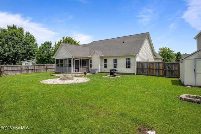 2902 Brems Battery, New Bern, NC 28562 - rear view of property with a fire pit, a fenced backyard, a sunroom, and roof with shingles
