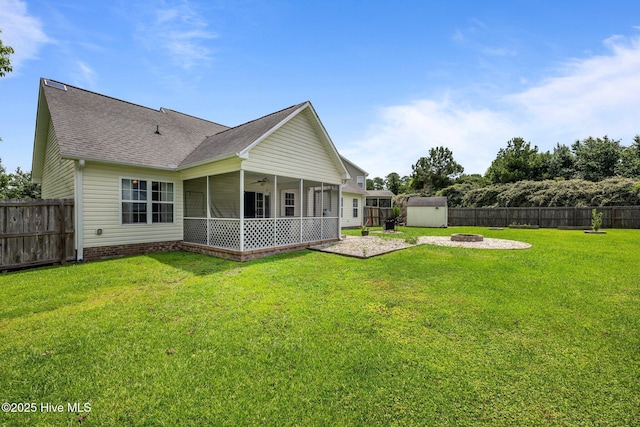 2902 Brems Battery, New Bern, NC 28562 - back of property featuring an outdoor fire pit, ceiling fan, a storage shed, roof with shingles, and a fenced backyard