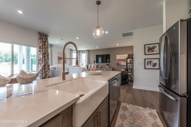 1016 Fawn Valley Way, Wilmington, NC 28409 - kitchen with appliances with stainless steel finishes, open floor plan, a sink, dark wood-type flooring, and recessed lighting
