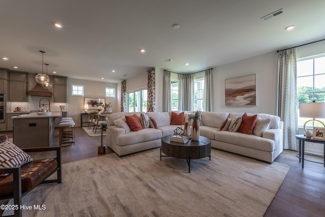1016 Fawn Valley Way, Wilmington, NC 28409 - living area with healthy amount of natural light, wood finished floors, and recessed lighting