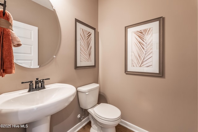 1016 Fawn Valley Way, Wilmington, NC 28409 - bathroom with a sink, toilet, baseboards, and wood finished floors