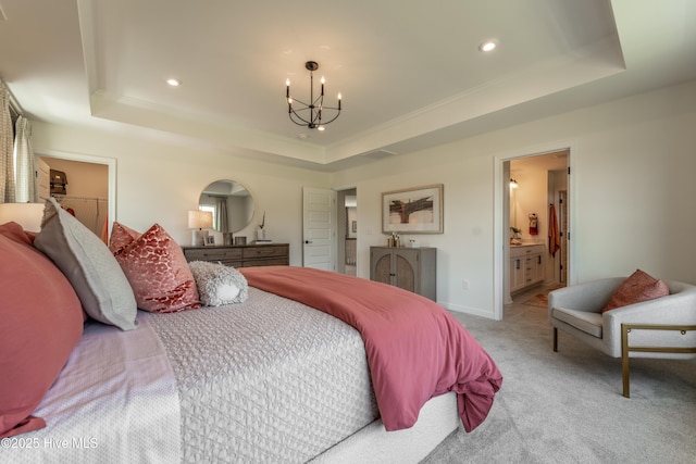 1016 Fawn Valley Way, Wilmington, NC 28409 - bedroom featuring a raised ceiling, a chandelier, light carpet, recessed lighting, and ensuite bathroom