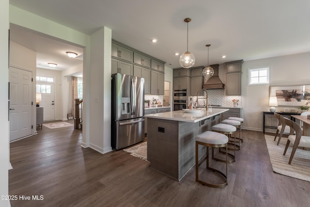 1016 Fawn Valley Way, Wilmington, NC 28409 - kitchen with stainless steel appliances, gray cabinets, light countertops, backsplash, and baseboards