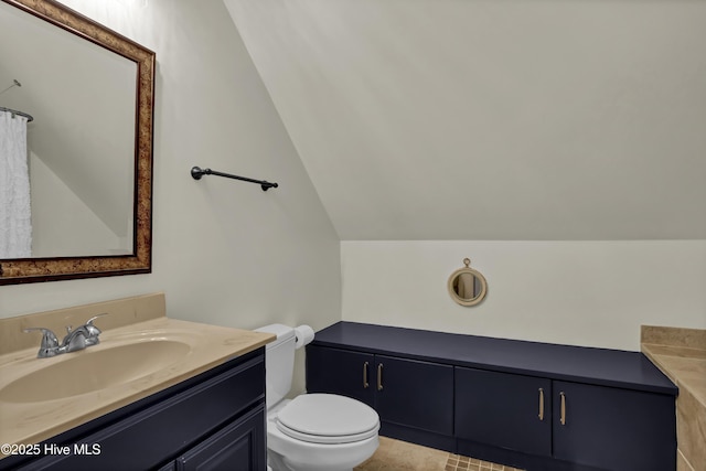3807 Ridge Crest Dr, Southport, NC 28461 - bathroom featuring vanity, toilet, and lofted ceiling