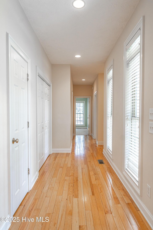 114 Baker Cir W, End, NC 27376 - hall featuring light wood finished floors, baseboards, and recessed lighting