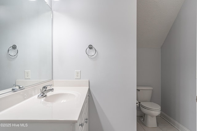 114 Baker Cir W, End, NC 27376 - half bath featuring tile patterned floors, vanity, toilet, and baseboards