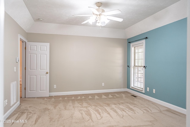 114 Baker Cir W, End, NC 27376 - spare room with a ceiling fan, light carpet, baseboards, vaulted ceiling, and a textured ceiling