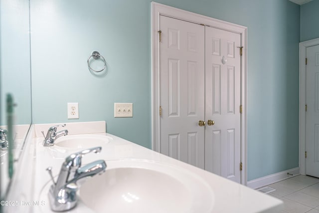 114 Baker Cir W, End, NC 27376 - bathroom with tile patterned floors, double vanity, and baseboards