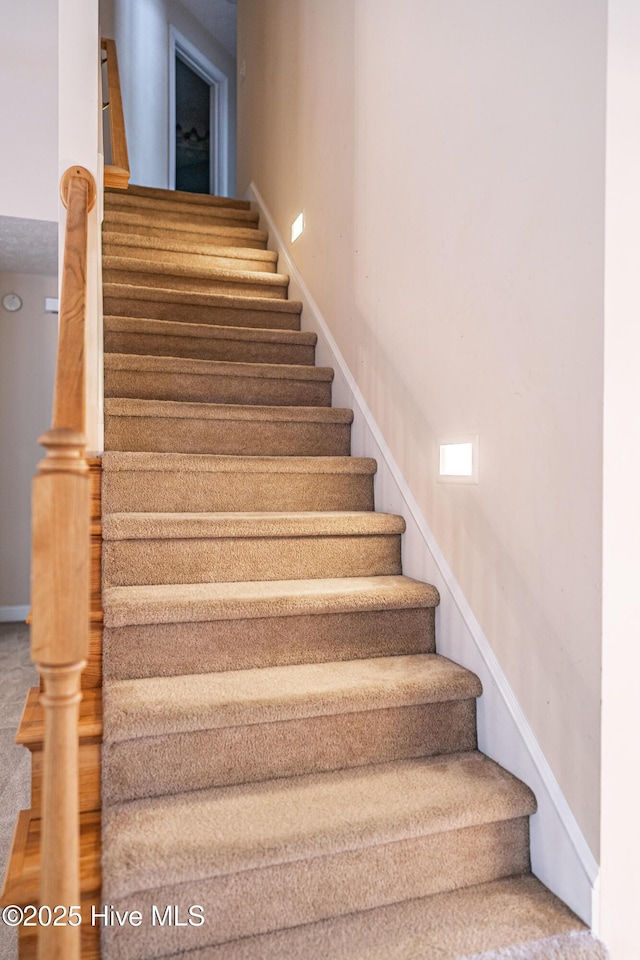 114 Baker Cir W, End, NC 27376 - staircase featuring baseboards