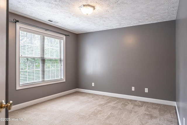114 Baker Cir W, End, NC 27376 - carpeted spare room with baseboards and a textured ceiling