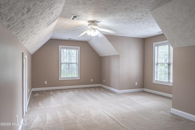 114 Baker Cir W, End, NC 27376 - bonus room with light carpet, a textured ceiling, ceiling fan, healthy amount of natural light, and lofted ceiling