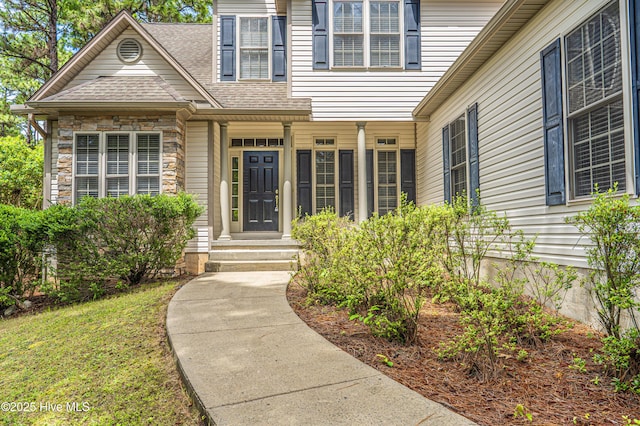 114 Baker Cir W, End, NC 27376 - view of exterior entry with a shingled roof and stone siding