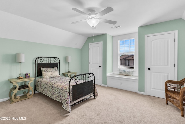 414 Wilson Ave, Carolina Beach, NC 28428 - carpeted bedroom with vaulted ceiling and ceiling fan