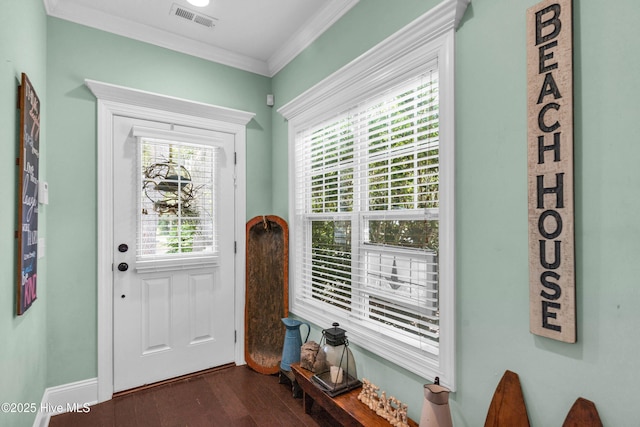 414 Wilson Ave, Carolina Beach, NC 28428 - foyer featuring dark wood-style floors and crown molding