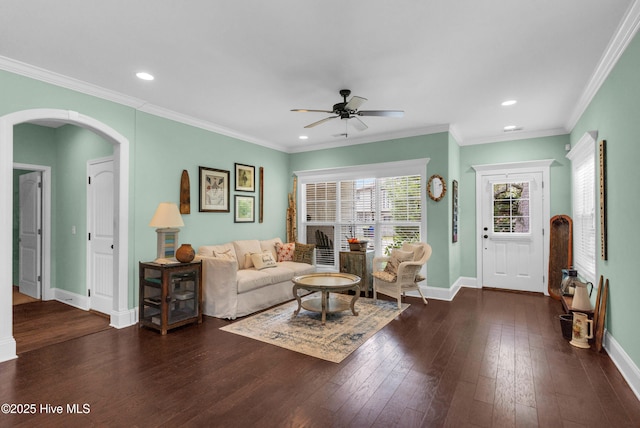 414 Wilson Ave, Carolina Beach, NC 28428 - living area with ceiling fan, arched walkways, dark wood-style flooring, recessed lighting, and ornamental molding