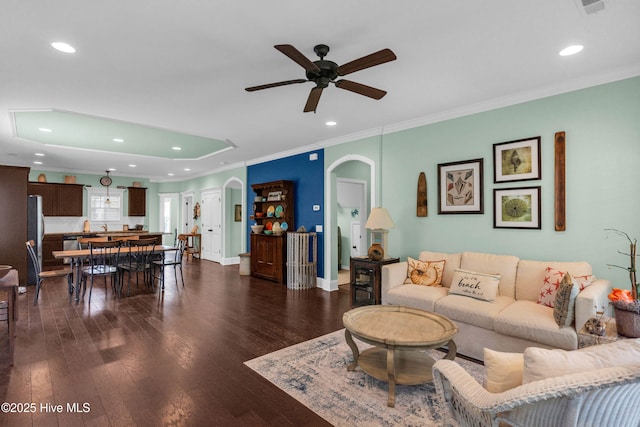 414 Wilson Ave, Carolina Beach, NC 28428 - living room featuring a ceiling fan, dark wood finished floors, ornamental molding, recessed lighting, and arched walkways