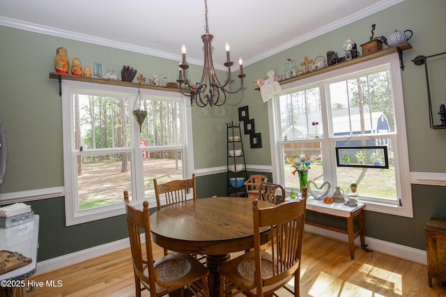 305 3rd St, Aberdeen, NC 28315 - dining area with a chandelier, light wood finished floors, healthy amount of natural light, and ornamental molding