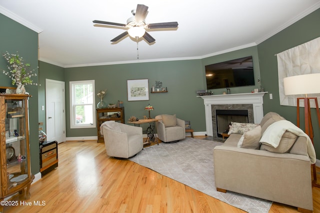 305 3rd St, Aberdeen, NC 28315 - living area with ceiling fan, wood finished floors, crown molding, a premium fireplace, and baseboards