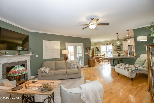 305 3rd St, Aberdeen, NC 28315 - living room featuring crown molding, ceiling fan, light wood finished floors, a premium fireplace, and baseboards