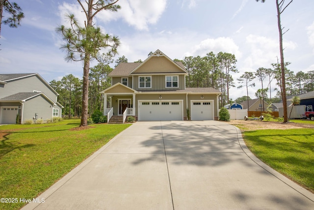 305 3rd St, Aberdeen, NC 28315 - craftsman house with concrete driveway, a front lawn, and a porch