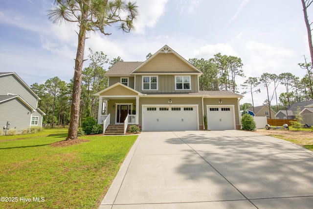 305 3rd St, Aberdeen, NC 28315 - craftsman inspired home featuring driveway, board and batten siding, covered porch, and an attached garage