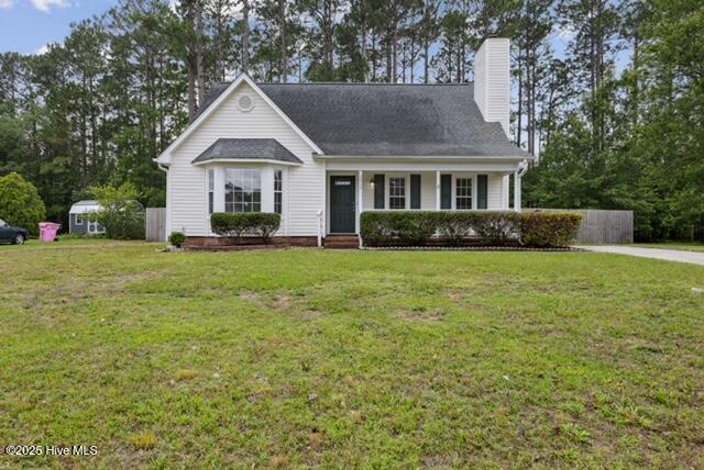 1415 Setter Ct, Wilmington, NC 28411 - view of front of house with a porch and a chimney