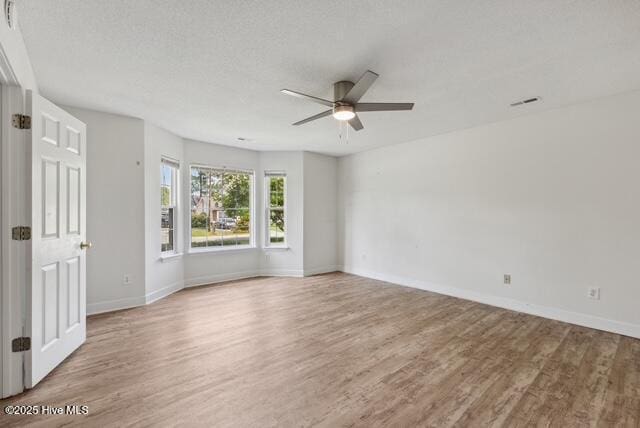 1415 Setter Ct, Wilmington, NC 28411 - empty room with ceiling fan, wood finished floors, and baseboards