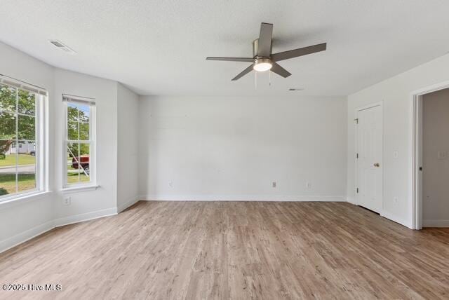 1415 Setter Ct, Wilmington, NC 28411 - spare room featuring wood finished floors, a ceiling fan, and baseboards