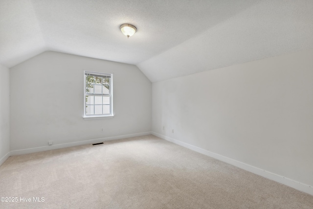 1415 Setter Ct, Wilmington, NC 28411 - bonus room with lofted ceiling, light colored carpet, and baseboards