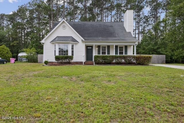 1415 Setter Ct, Wilmington, NC 28411 - view of front facade with a chimney and covered porch