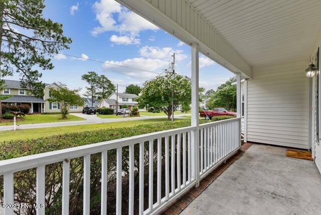 1415 Setter Ct, Wilmington, NC 28411 - covered porch featuring a residential view