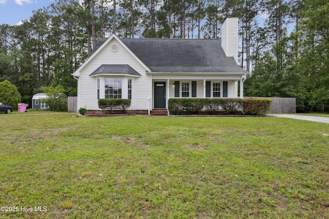 1415 Setter Ct, Wilmington, NC 28411 - view of front of home with a chimney, a porch, and a shingled roof