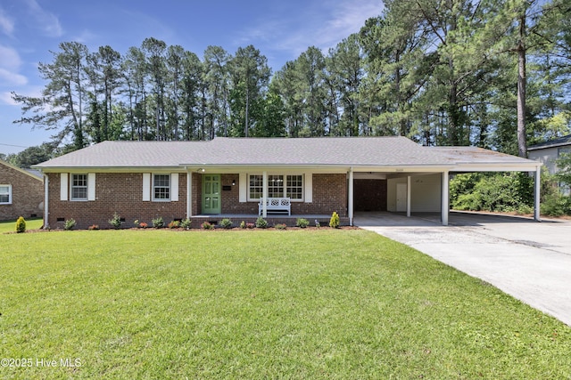 single story home with a carport, a front yard, brick siding, and concrete driveway