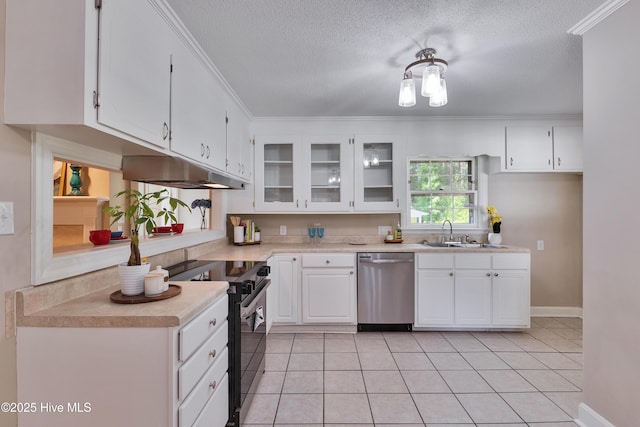 kitchen with dishwasher, a sink, electric range oven, light countertops, and a textured ceiling