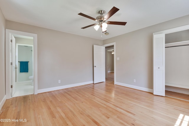 unfurnished bedroom featuring light wood-style floors, baseboards, a closet, and ceiling fan