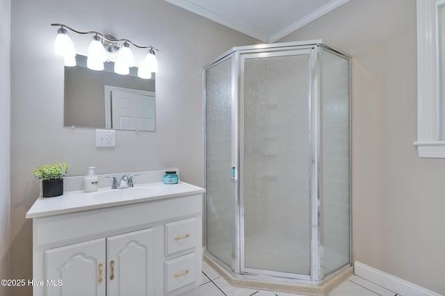 full bath featuring crown molding, vanity, a shower stall, and tile patterned floors