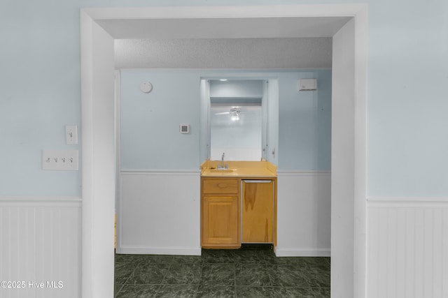 2306 W Fort Macon Rd Unit 209H, Atlantic Beach, NC 28512 - hall featuring a wainscoted wall and a sink