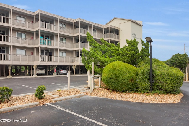 2306 W Fort Macon Rd Unit 209H, Atlantic Beach, NC 28512 - view of apartment building / complex with uncovered parking