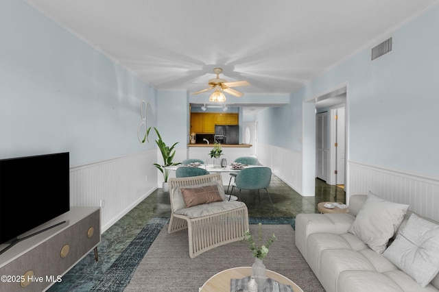 2306 W Fort Macon Rd Unit 209H, Atlantic Beach, NC 28512 - living room with a wainscoted wall and a ceiling fan