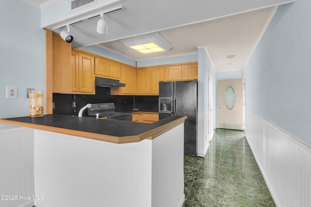 2306 W Fort Macon Rd Unit 209H, Atlantic Beach, NC 28512 - kitchen featuring range, black fridge, dark countertops, a peninsula, and wainscoting
