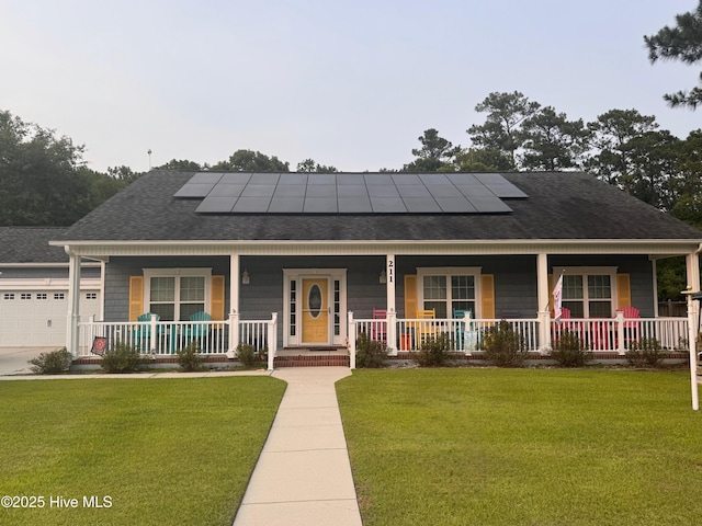 211 Brook Crossing Rd, Swansboro, NC 28584 - view of front facade with covered porch, a shingled roof, a front lawn, and solar panels
