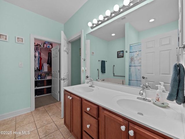 211 Brook Crossing Rd, Swansboro, NC 28584 - bathroom with double vanity, tile patterned floors, and a spacious closet