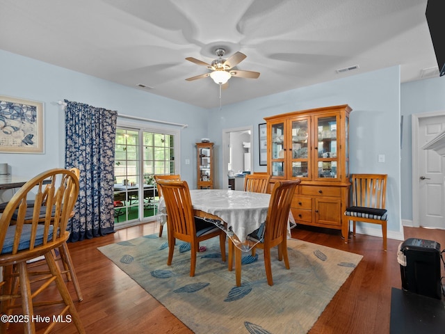 211 Brook Crossing Rd, Swansboro, NC 28584 - dining area with ceiling fan and dark wood-style floors