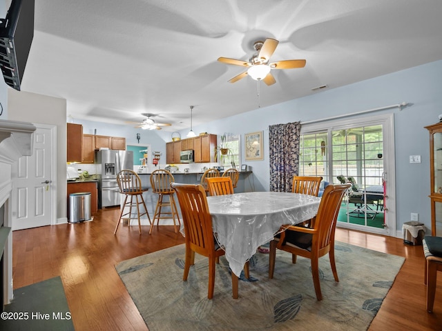 211 Brook Crossing Rd, Swansboro, NC 28584 - dining area with ceiling fan and dark wood-type flooring