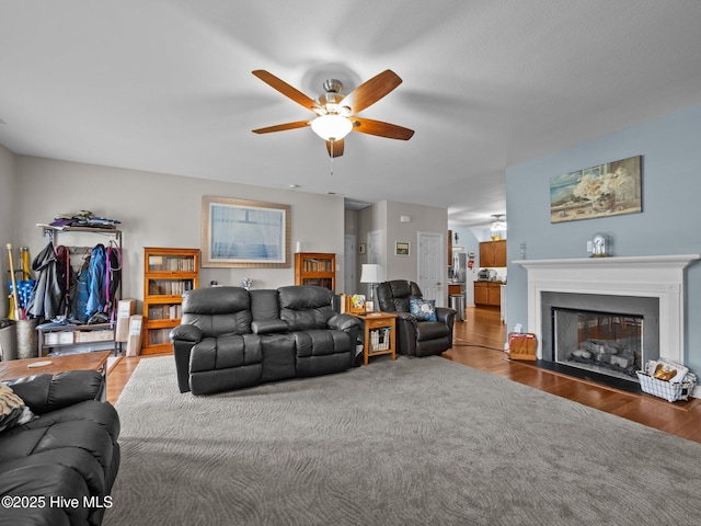 211 Brook Crossing Rd, Swansboro, NC 28584 - living area featuring a ceiling fan, a fireplace with flush hearth, and wood finished floors