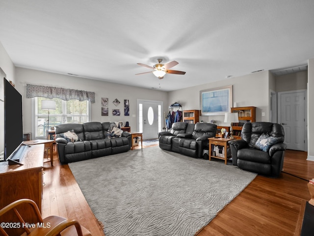 211 Brook Crossing Rd, Swansboro, NC 28584 - living room with a ceiling fan and wood finished floors