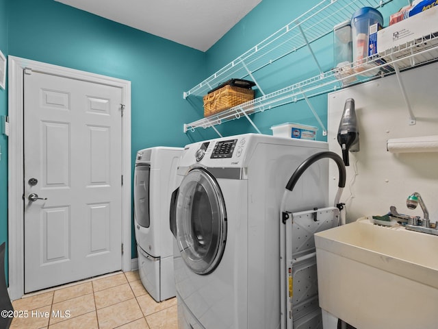 211 Brook Crossing Rd, Swansboro, NC 28584 - laundry room with washing machine and dryer and light tile patterned flooring
