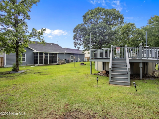 211 Brook Crossing Rd, Swansboro, NC 28584 - view of grassy yard featuring stairway, a deck, and a sunroom